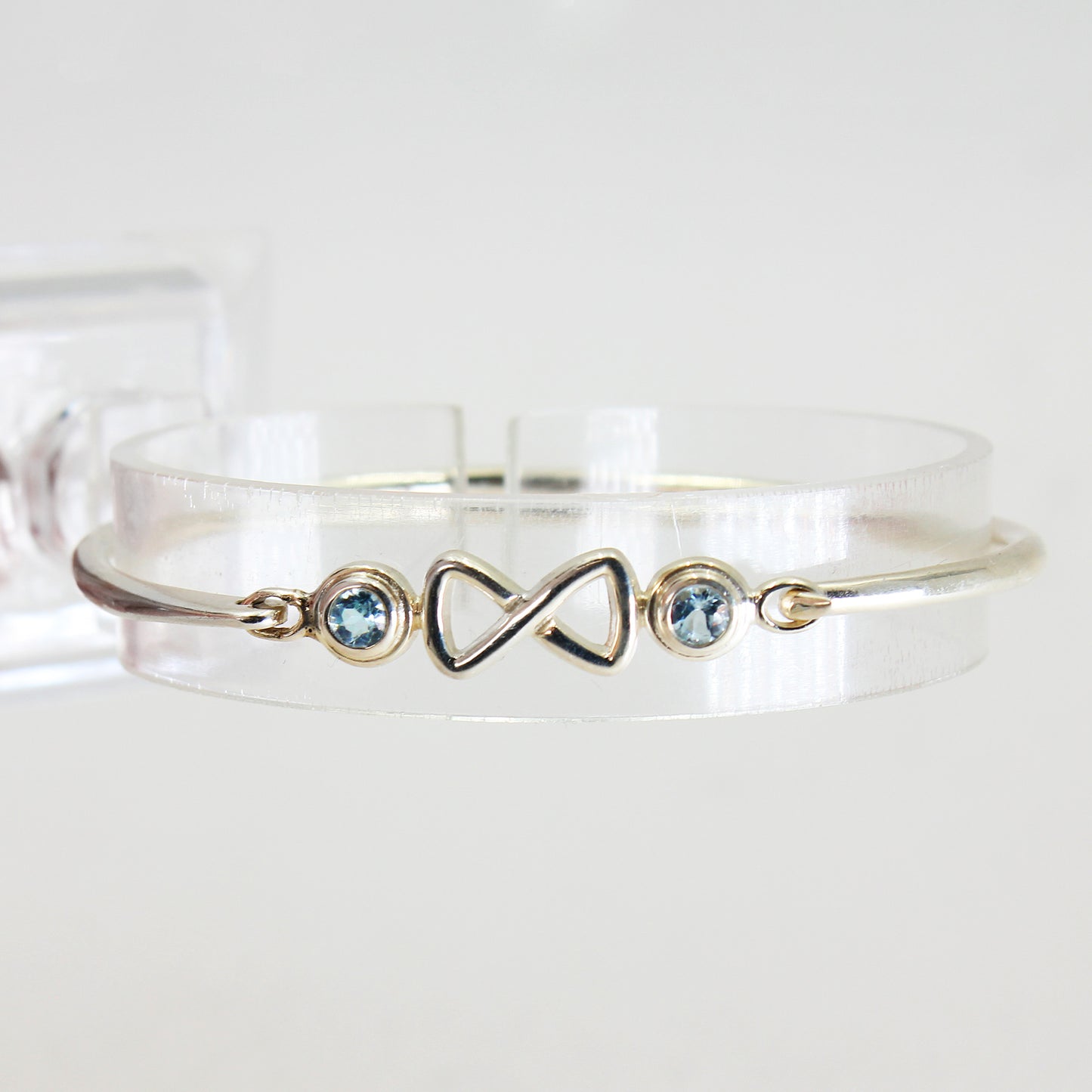 Sterling Silver Cuff-Style Light Blue Stone Infinity Bracelet