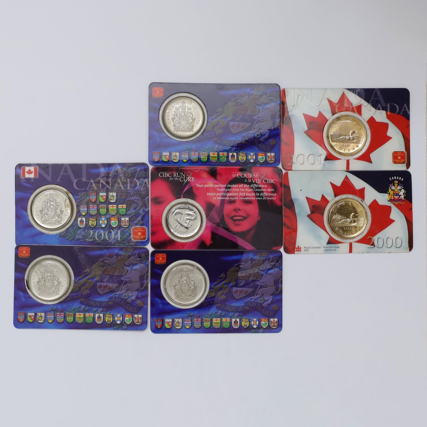 Lot of 7x Royal Canadian Mint Coins in Cards (may have scuffs, toning, or light issues)