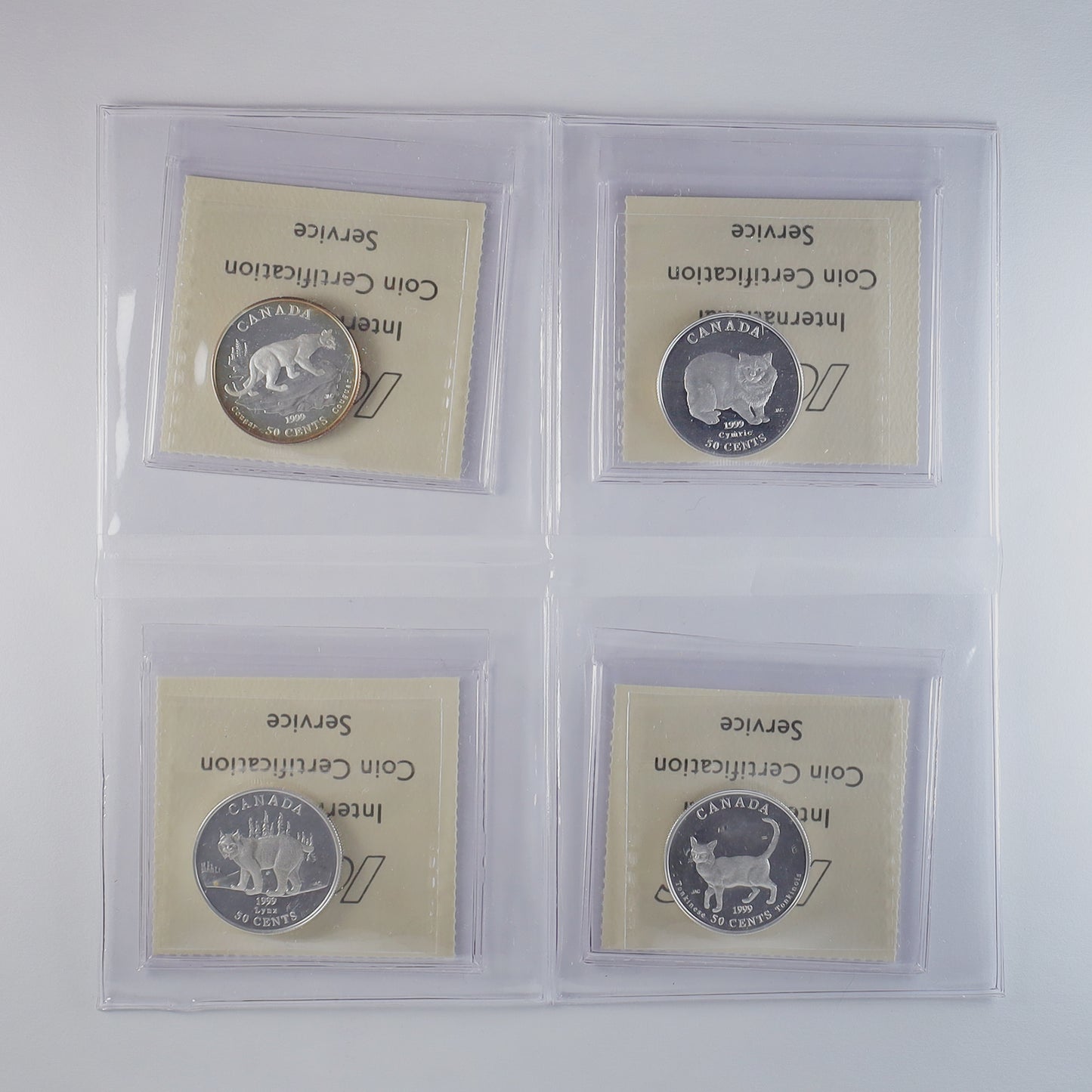 Lot of 4x 1999 50-cent Cats of Canada Sterling ICCS Cert. PF66 or PF67 UHC, 4pcs (toning)