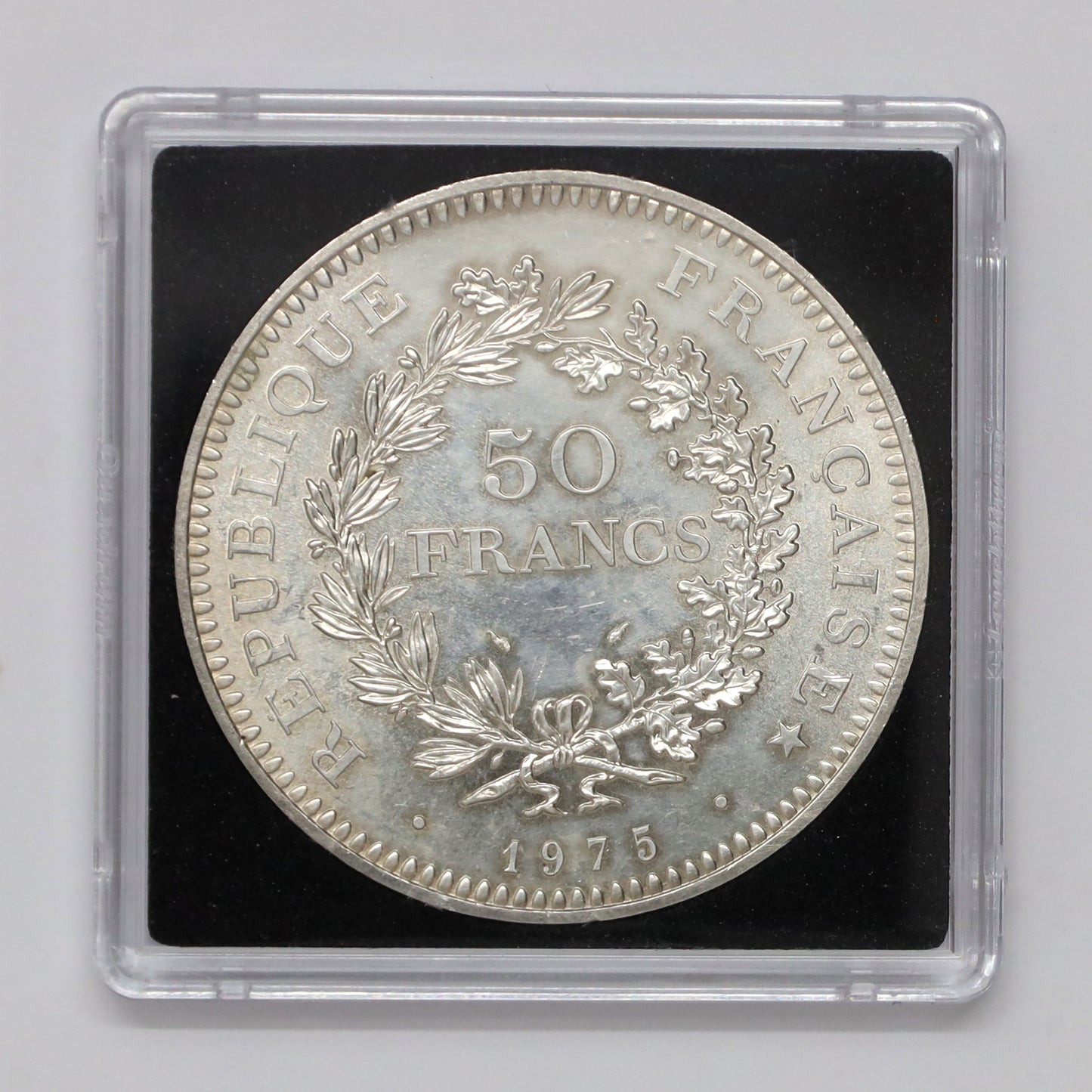 France 1975 Hercules 50 Francs .900 Silver Coin (light toning, scratched capsule)