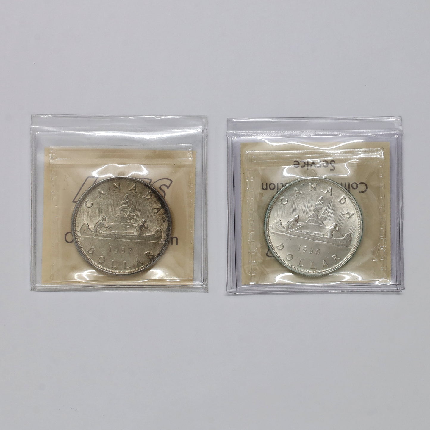 Pair of 1936 & 1937 Canada Silver Dollars ICCS Certified MS60, 2pcs
