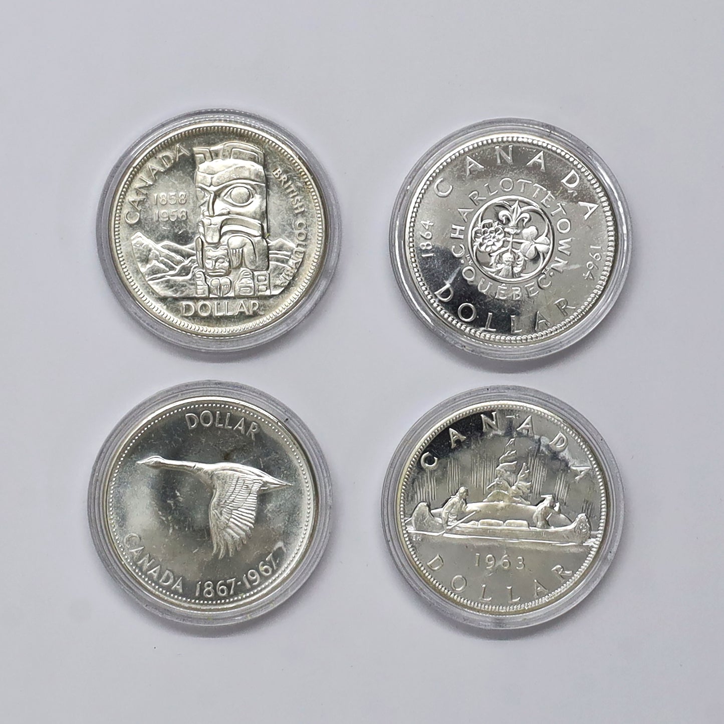 Canada's Four Queen Elizabeth II Silver Dollars 4-Coin Set in Case (light wear)
