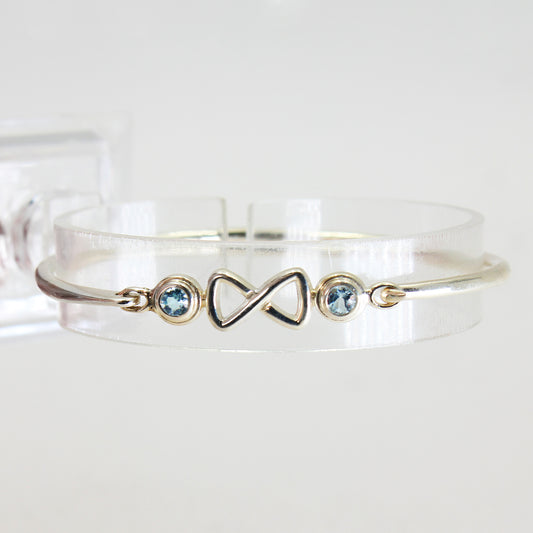 Sterling Silver Cuff-Style Light Blue Stone Infinity Bracelet