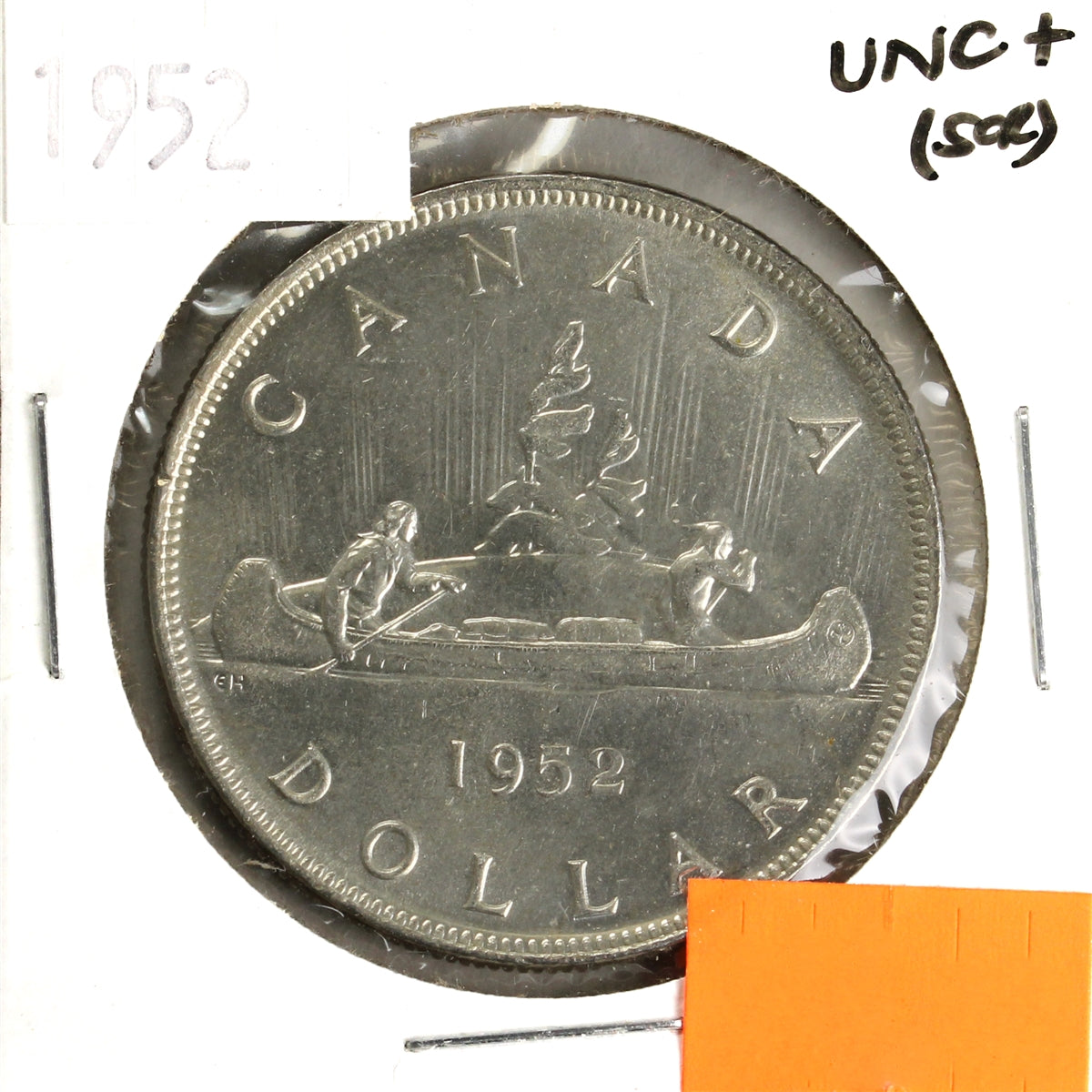 1952 Canada Dollar UNC+ (MS62) Scratched, toned, or impaired