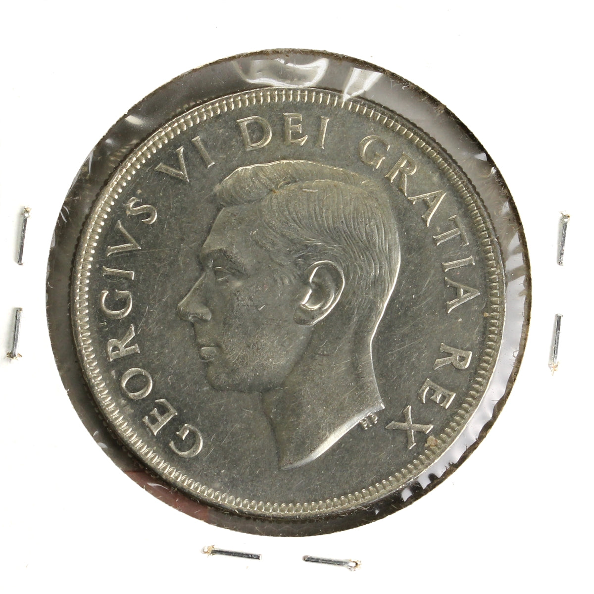 1952 Canada Dollar UNC+ (MS62) Scratched, toned, or impaired