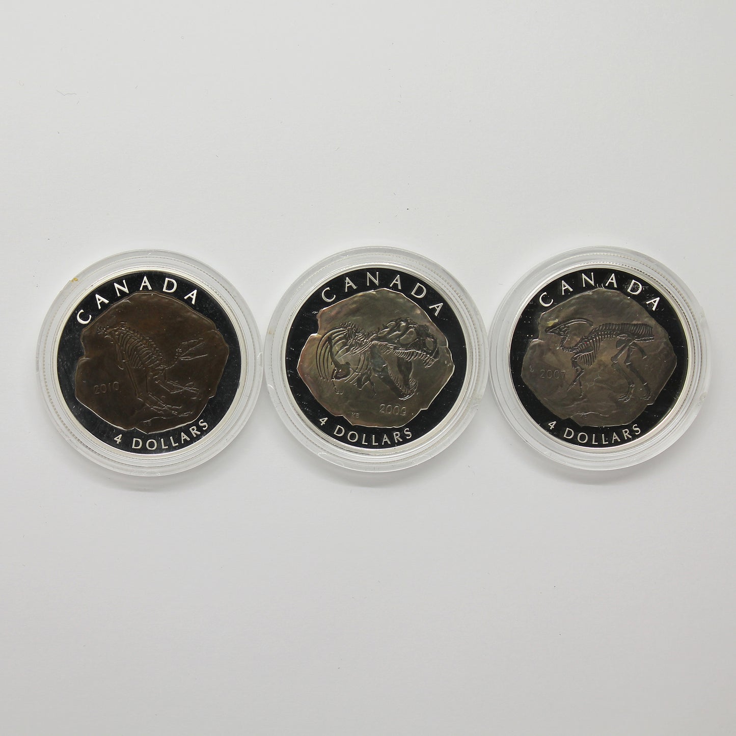 Lot of 3x 2007-2010 Canada $4 Dinosaurs Silver, 4pcs (No Tax) Coins Only (Scr. Caps)
