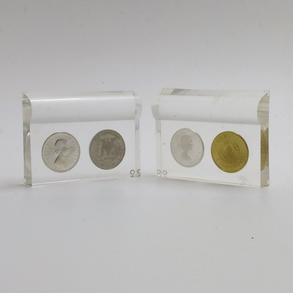 Pair of 1964 Canada Dollars & Corporate Milestone Tokens in Lucite Displays, 2pcs (Light Wear)