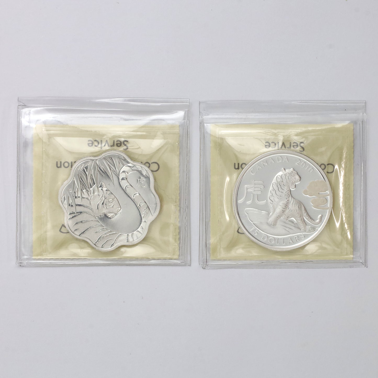 Pair of 2010 Canada $15 Year of the Tiger Fine Silver ICCS Cert. PF67 UHC, 2pcs