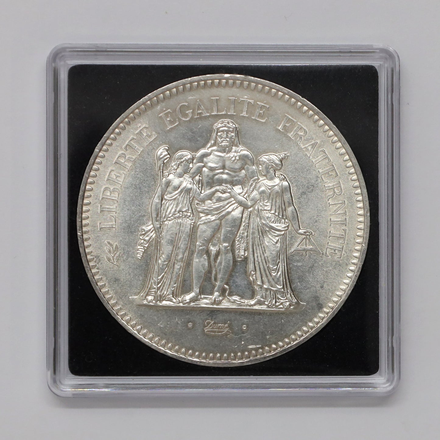 France 1975 Hercules 50 Francs .900 Silver Coin (light toning, scratched capsule)