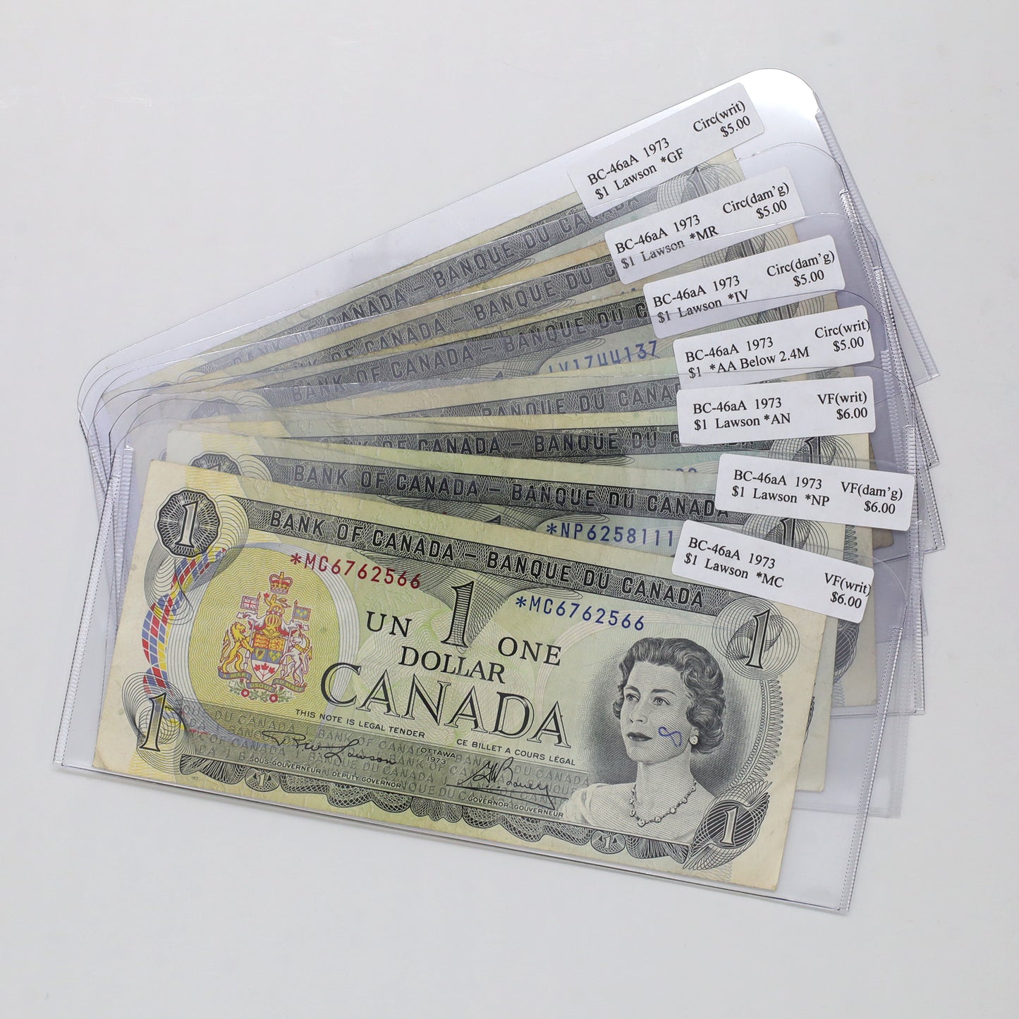 Lot of 7x BC-46aA 1973 Canada $1 Lawson-Bouey Replacements, Circ to VF, 7pcs (damage)