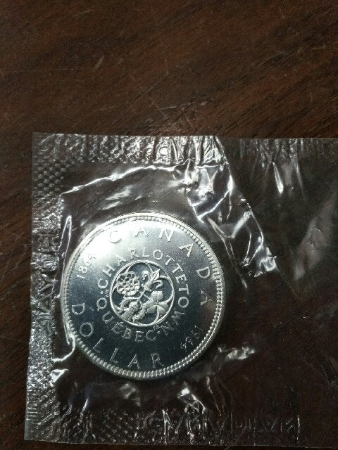 1964 Canada Proof Like Silver Dollar in Cellophane (May be lightly toned)