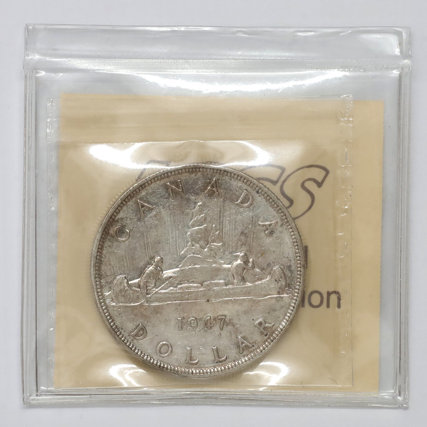 1947 Pointed 7 Canada Dollar ICCS Certified AU50 (lightly toned)